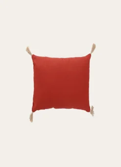 COUSSIN EN COTON UNI AVEC PETITS POMPONS ROUILLE