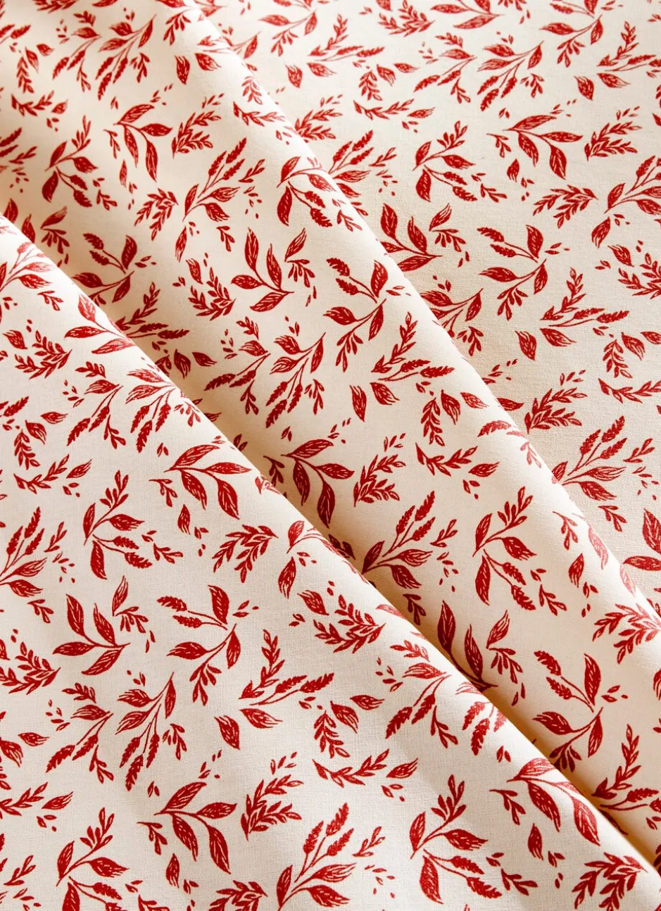 NAPPE ENDUITE À MOTIF VÉGÉTAL BEIGE / BORDEAUX