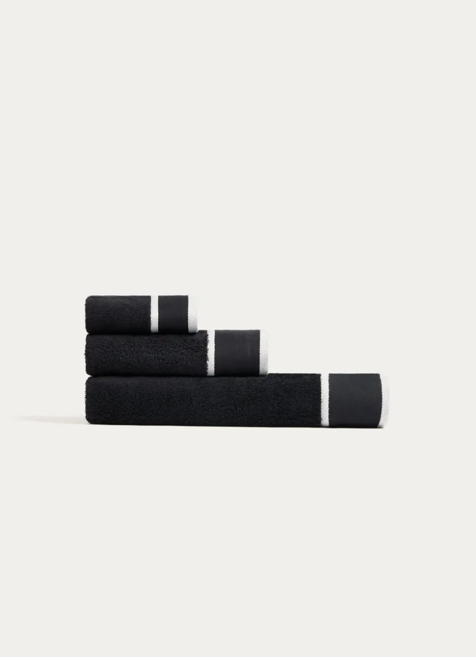 SERVIETTE DE TOILETTE UNIE À LARGE BORDURE ARTHUR Noir