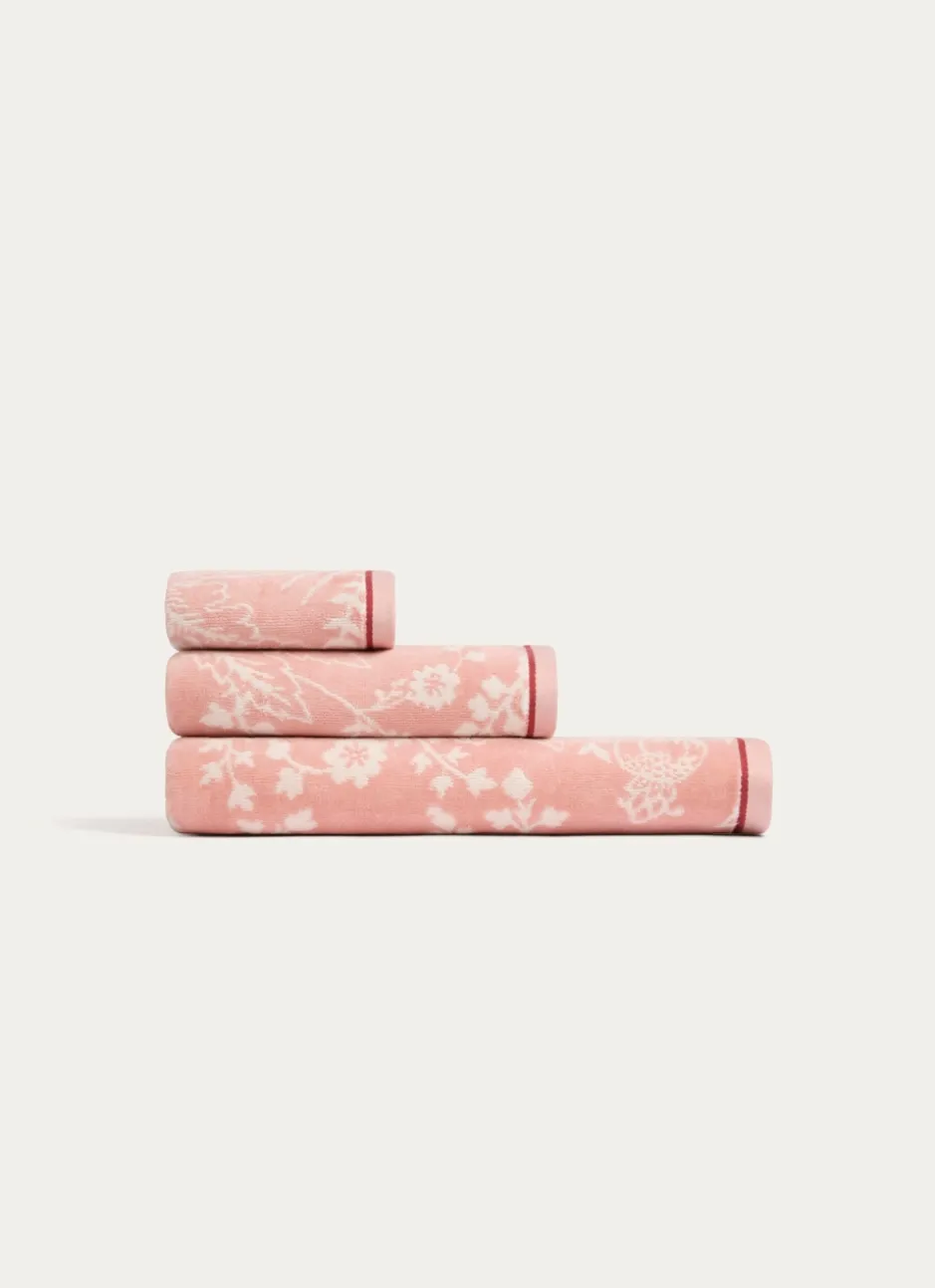 SERVIETTE INVITÉ JADE À GRANDS MOTIFS FLORAUX ROSE CLAIR