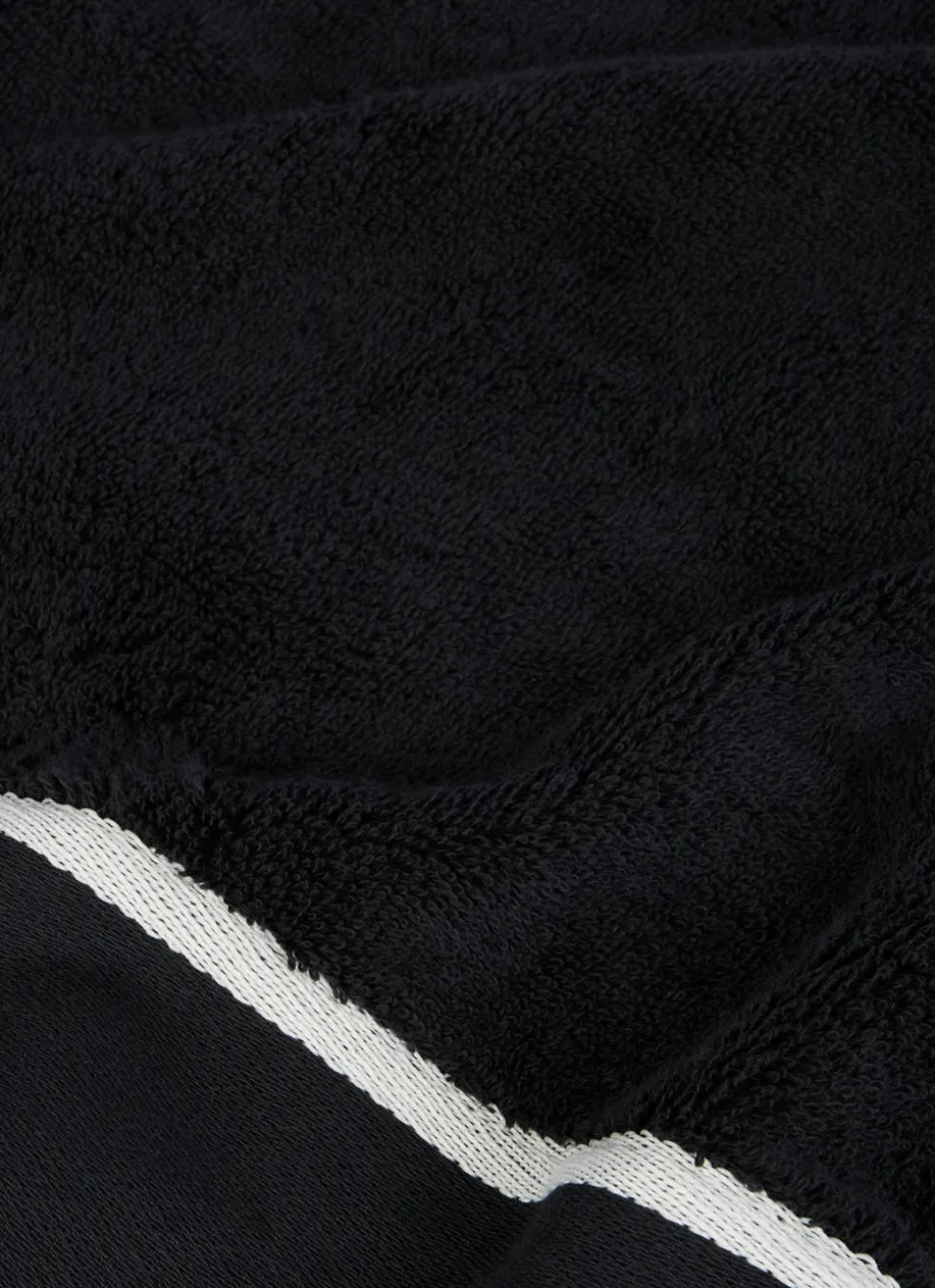 SERVIETTE INVITÉ UNIE À LARGE BORDURE ARTHUR Noir